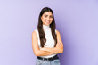 © Asier - Young indian woman isolated on purple background who feels confident, crossing arms with determination.
