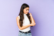 © Asier - Young indian woman isolated on purple background massaging elbow, suffering after a bad movement.