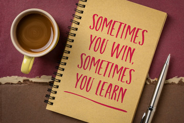 Wall Mural - Sometimes you win, sometimes you learn - inspirational handwriting on a sketchbook with a cup of coffee, success and failure, business, education and personal development concept