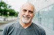 © Eugenio Marongiu/Westend61 - Close-up of smiling senior man in city