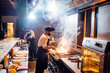 © Oscar Carrascosa Martinez/Westend61 - Chefs wearing protective face masks preparing a dish in restaurant kitchen