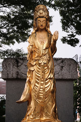 Golden Religious Statues at a Local Buddhis Temple in Busan, South Korea