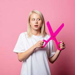 Wall Mural - Blonde woman in white moch-up tshirt with big scissors