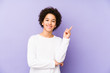 © Asier - African american little boy isolated smiling cheerfully pointing with forefinger away.
