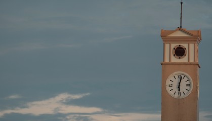 old clock tower in evening sky .