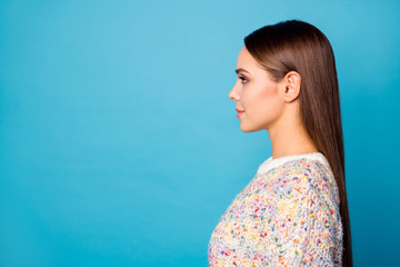 Wall Mural - Closeup profile photo of cute attractive lady perfect long straight hairdo look side empty space not smiling wear casual warm sweater isolated blue color background