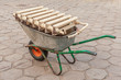 © Mariia - a wheelbarrow with an old cast-iron radiator for recycling