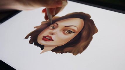 Close up of a digital pen drawing artwork on a graphic tablet