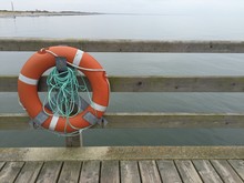 Orange Lifebuoy On Peer At Baltic Sea