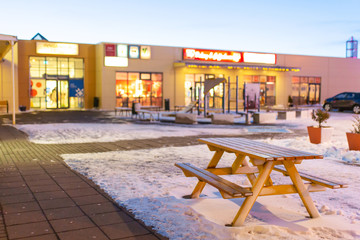 Wall Mural - A table with a bench for resting covered with snow in winter in Iceland.