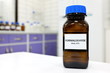 Selective focus of formaldehyde or formalin in brown amber glass bottle inside a laboratory. Blurred background with copy space.