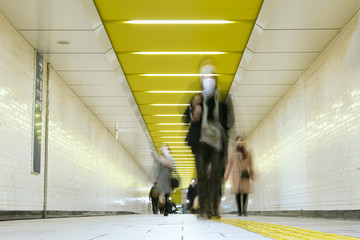 Wall Mural - Pedestrians wearing surgical masks in subway station, Tokyo　マスクをつけた人々 東京の地下鉄駅の構内