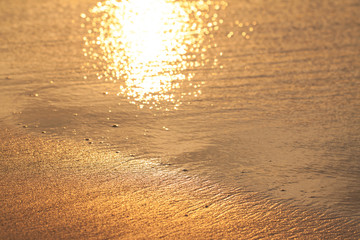 wet golden sand on the sunset, abstract texture