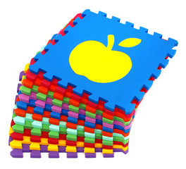 Fototapete - mat puzzle figures - multicolored soft elements on a white background