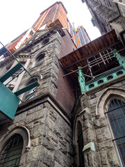 Canvas Print - close view of Midtown Manhattan 39th Street church in front of construction building