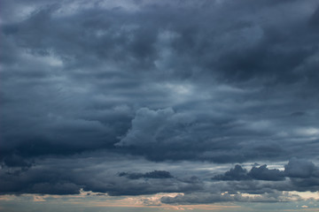 Wall Mural - cloudy sky with dark blue heavy clouds. dark blue dramatic sky background.
