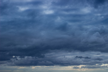 Wall Mural - cloudscape with blue heavy clouds on the sky. cloudy sky with dark blue heavy clouds. dark blue dram