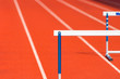 © Augustas Cetkauskas - Hurdle on the red running track prepared for competition