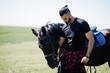 © AS Photo Family - Arab tall beard man wear in black with arabian horse.