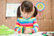 © M-image - young girl play number sticks for homeschooling