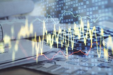 Aufkleber - Double exposure of financial chart drawings and desk with open notebook background. Concept of forex market