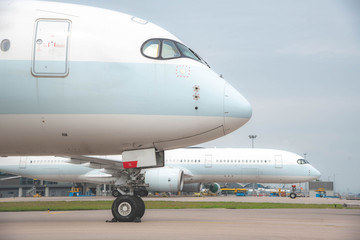 Due to Coronavirus Covid-19 airline fleet parked at the taxiway of Airport 