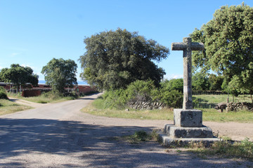 Wall Mural - Stone cross on the roads of Santiago captured at daytime