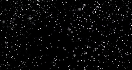 Wall Mural - blizzard of snow at night. it shows the white flakes moving fast on the isolated black background.
