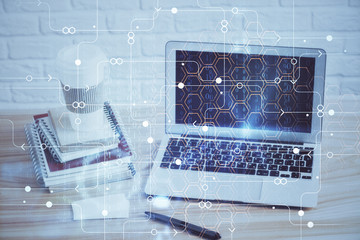 double exposure of desktop computer and technology theme hologram. concept of software development.