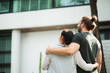 © Nopphon - Husband and pregnant wife standing in front of and looking the house feeling happy. Insurance home family concept.
