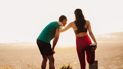 Fitness couple relaxing after a run