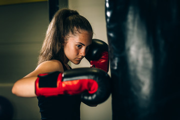 woman kick boxing or boxing training