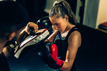 woman kick boxing or boxing training