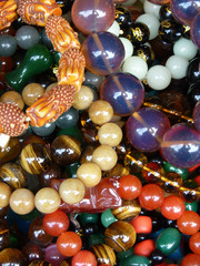 Sticker - Vertical shot of colorful round stone beads of jewelries