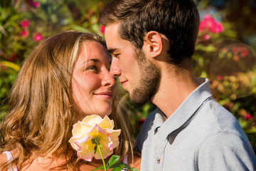 young man offering a rose to his darling