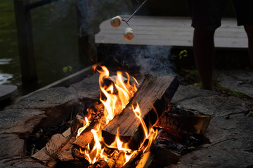 Sticker - High angle shot of a burning camp fire in the dark atmosphere