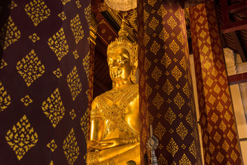 Ayutthaya, Thailand - June, 22, 2020 : Golden buddha image in ancient temple in Ayutthaya , Thailand