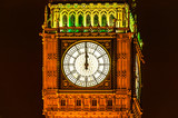 Fototapeta Big Ben - Big Ben of the Houses of Parliament London, England UK at night striking midnight on New Years Eve which is a popular travel destination tourist attraction landmark of the city centre stock photo 