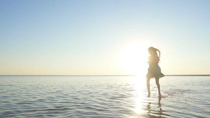 Wall Mural - happy child girl  running at the sea