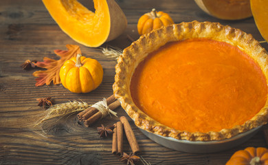 Wall Mural - Fresh homemade pumpkin pie on the wooden table