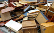 Old broken wooden furniture on waste dump site