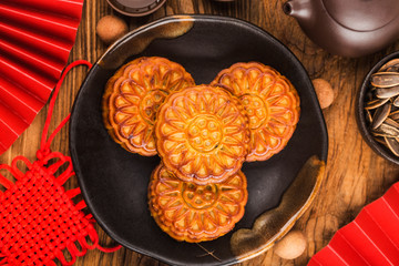 Poster - Mid-Autumn Festival concept, Traditional mooncakes on table  with teacup.