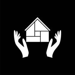 Wall Mural - Hands holding house icon isolated on dark background