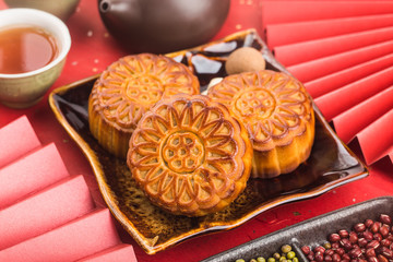 Poster - Mid-Autumn Festival concept, Traditional mooncakes on table  with teacup.