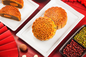 Poster - Mid-Autumn Festival concept, Traditional mooncakes on table  with teacup.