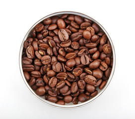 Poster - Top view of roasted coffee beans in a bowl isolated on a white background