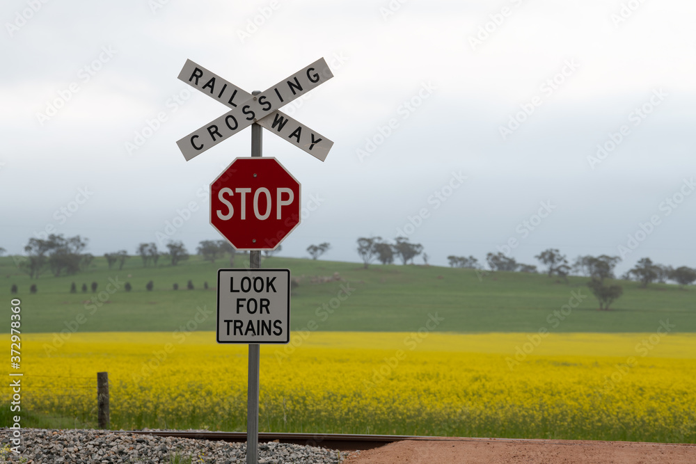 Look Out For Train Sign Sign that says 'Crossing Railway Stop Look for trains' posted on the ...
