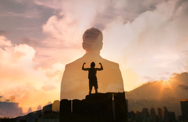 Wall Mural - strong man standing facing city sunrise feeling full strength and power with in. motivational image 