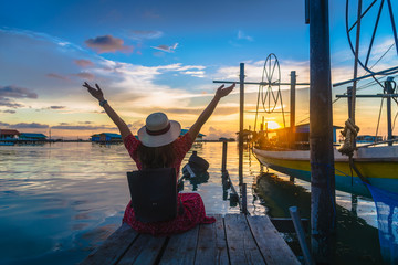 Traveler woman on wood bridge joy beautiful nature scenic landscape Songkhla lake at sunset, Attraction famous landmark tourist travel Thailand summer vacation trips, Tourism destinations place Asia