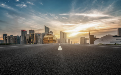 Empty asphalt road along modern commercial buildings in China, s cities